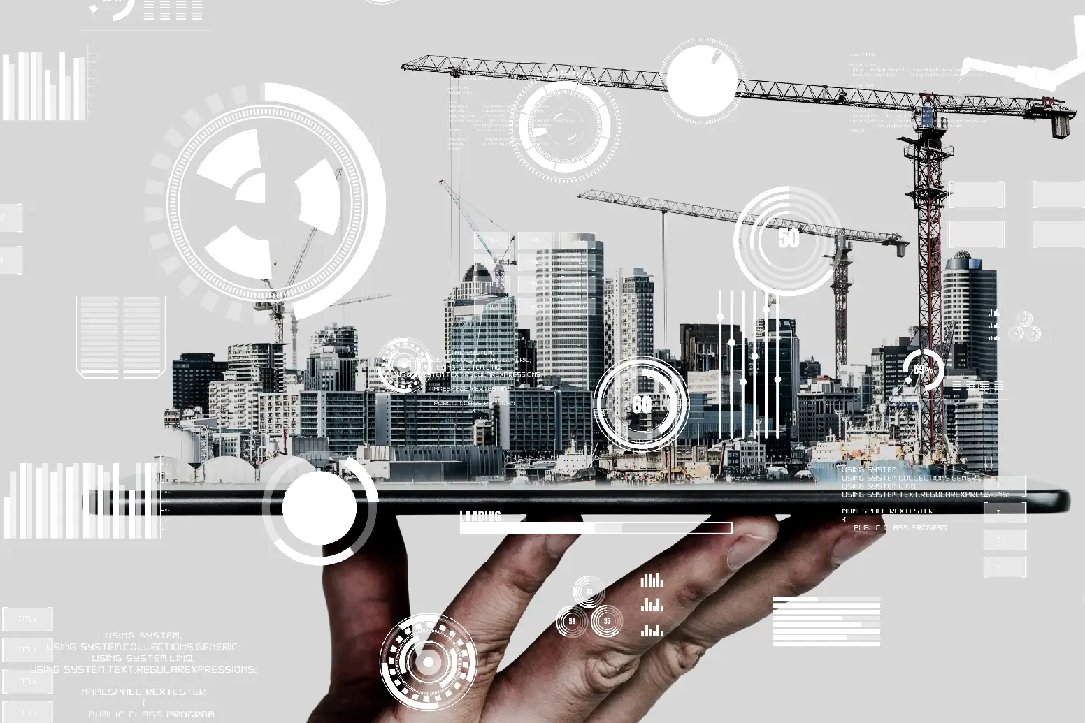 Hand holding a digital tablet projecting a holographic 3D city model with construction cranes and graphical data interfaces